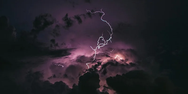 Lightning storm over outdoor aquaculture farm