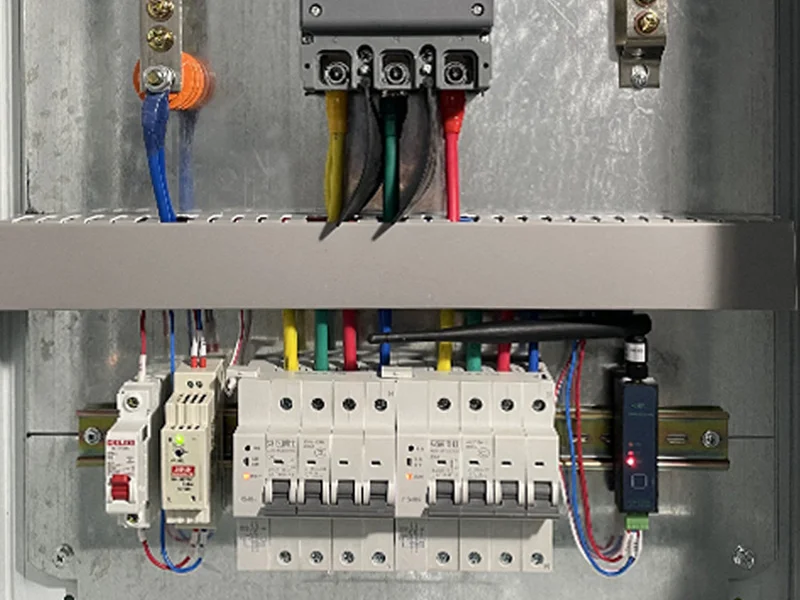 Power monitoring components and connected breakers inside a distribution cabinet
